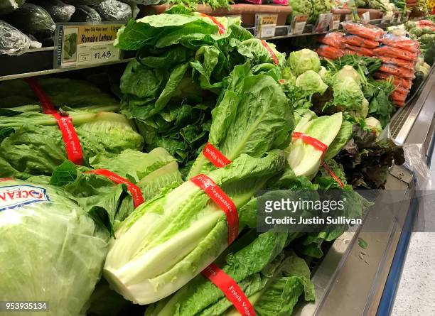 Romaine lettuce is displayed at a grocery store on May 2, 2018 in San Anselmo, California. One person in California has died from E. Coli linked to...
