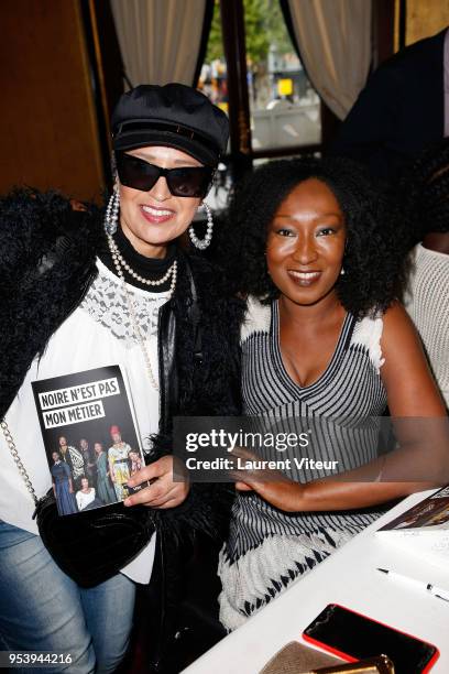 Singer Laam and Actress Nadege Beausson-Diagne attend "Noire n'est pas mon Metier" Book Signing at Le Fouquet's on May 2, 2018 in Paris, France.