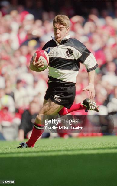 Tim Horan of Barbarians runs with the ball during the Scottish Amicable Tour match against Wales played at the Millennium Stadium, in Cardiff, Wales....