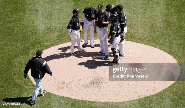 Pitching coach Don Cooper of the Chicago White Sox walks toward the pitching mound to talk to James Shields during the game against the Seattle...