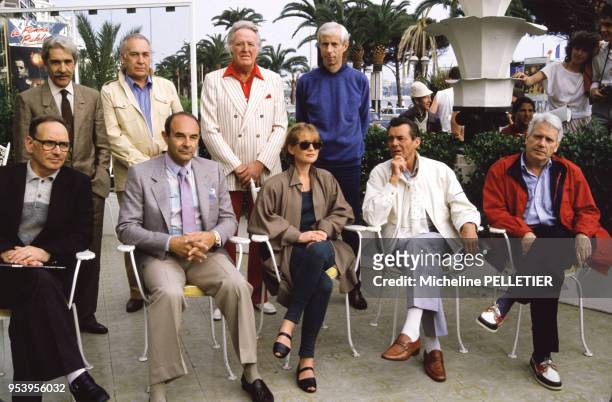 Isabelle Huppert, Jorge Semprun, Dirk Bogarde, Stanley Donen, Michel Deville, Ennio Morricone lors du Festival de Cannes le 12 mai 1984, France.