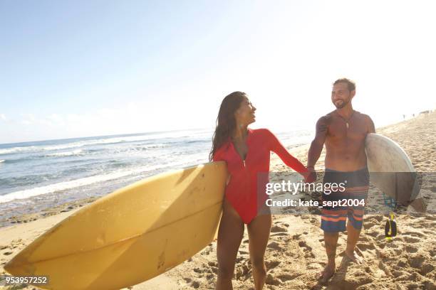 taking a vacation with the spouse - urban beach couple stock pictures, royalty-free photos & images
