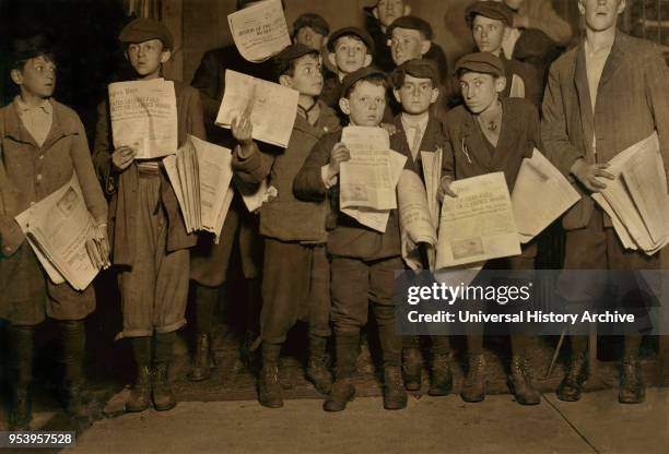 Group of Young Newsies, Full-Length Portrait Selling Newspapers on 12th Street after Midnight, Washington DC, USA, Lewis Hine for National Child...