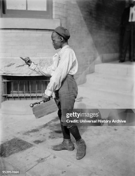 Young Boy with Shoe Shine Kit, Detroit Publishing Company, 1901.