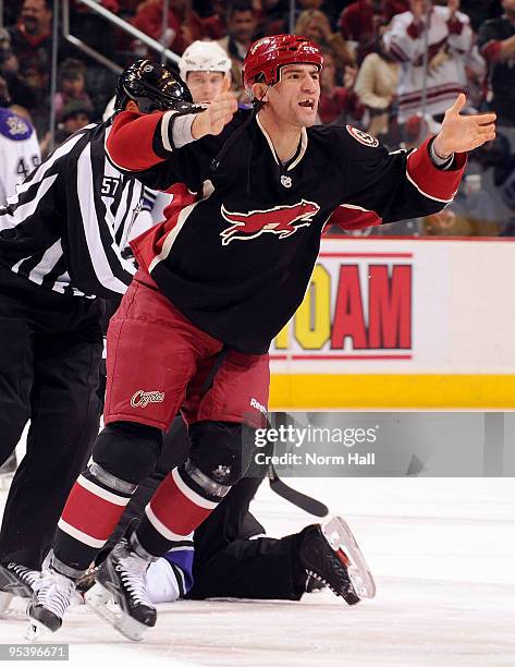 Paul Bissonnette of the Phoenix Coyotes plays to the crowd after a fight with a Los Angeles Kings player on December 26, 2009 at Jobing.com Arena in...