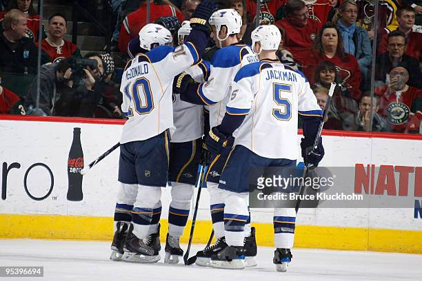 St. Louis Blues celebrate a second period goal by Andy McDonald during the game at the Xcel Energy Center on December 26, 2009 in Saint Paul,...