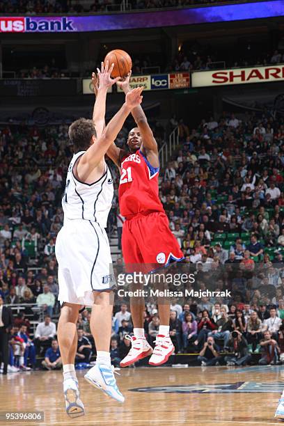 Mehmet Okur of the Utah Jazz goes to block a shot by Thaddeus Young of the Philadelpha 76ers at EnergySolutions Arena on December 26, 2009 in Salt...