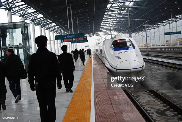 Trainmen are ready for the arriving of the CRH train G1027 of the Wuhan-Guangzhou high-speed railway at the Chenzhou West Railway Station on December...