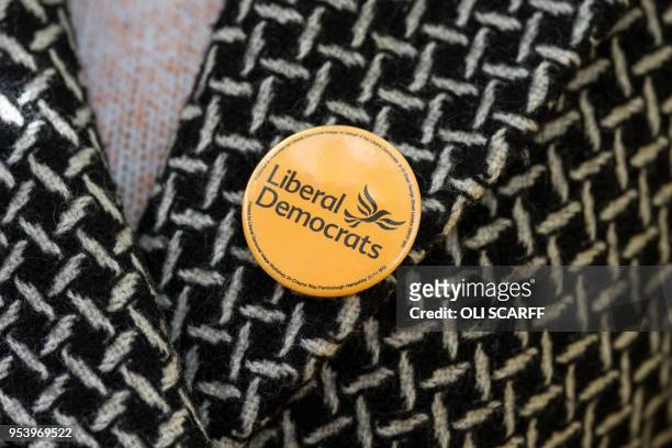 Liberal Democrats pin badge worn by Mary D'Albert, a Liberal Democrats councillor, is pictured as she canvasses ahead of tomorrow's local elections,...