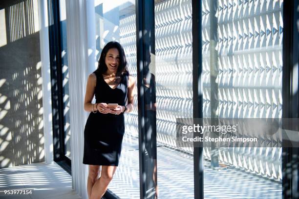 portrait of asian woman in new city high-end condo - women wearing nothing - fotografias e filmes do acervo