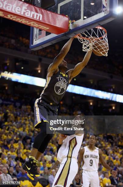 Andre Iguodala of the Golden State Warriors dunks on Nikola Mirotic of the New Orleans Pelicans during Game Two of the Western Conference Semifinals...