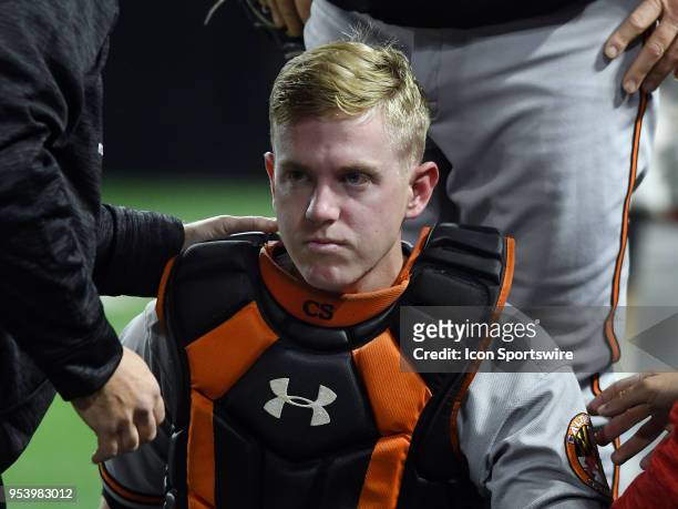 Baltimore Orioles catcher Chance Sisco is looked at by trainers on the field after taking an elbow to the head from third baseman Pedro Alvarez in...