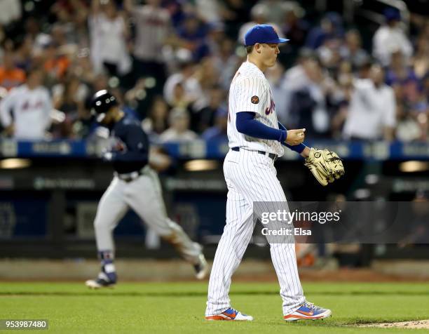 Paul Sewald of the New York Mets reacts as Ender Inciarte of the Atlanta Braves rounds third base after a two run home run in the seventh inning aon...