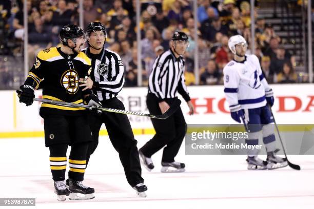 Brad Marchand of the Boston Bruins disputes a slashing call during the second period of Game Three of the Eastern Conference Second Round during the...