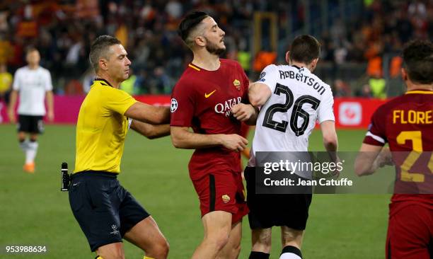 Kostas Manolas of AS Roma collides with Andrew Robertson of Liverpool while referee Damir Skomina of Slovenia tries to intervene during the UEFA...