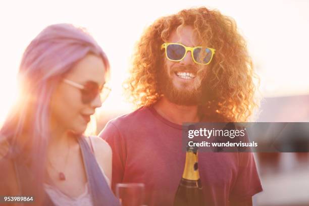 young hipster friends partying with champagne at summer party - pink hair stock pictures, royalty-free photos & images