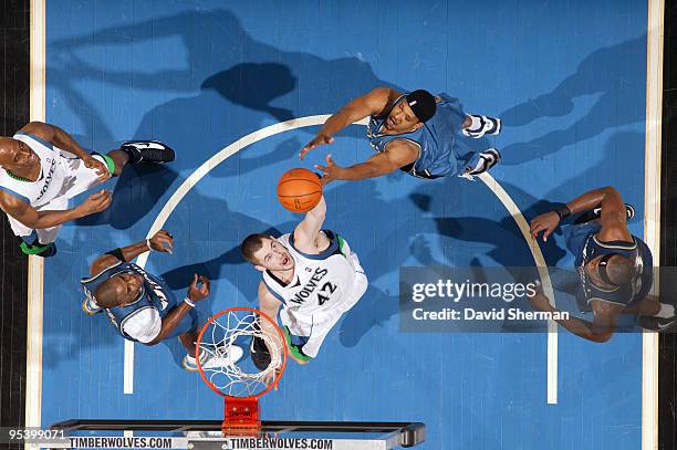 Kevin Love of the Minnesota Timberwolves pulls down the rebound against Dominic McGuire of the Washington Wizards during the game on December 26,...