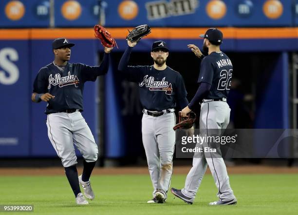 Ronald Acuna Jr. #13,Ender Inciarte and Nick Markakis of the Atlanta Braves celebrate the 7-0 win over the New York Mets on May 2, 2018 at Citi Field...
