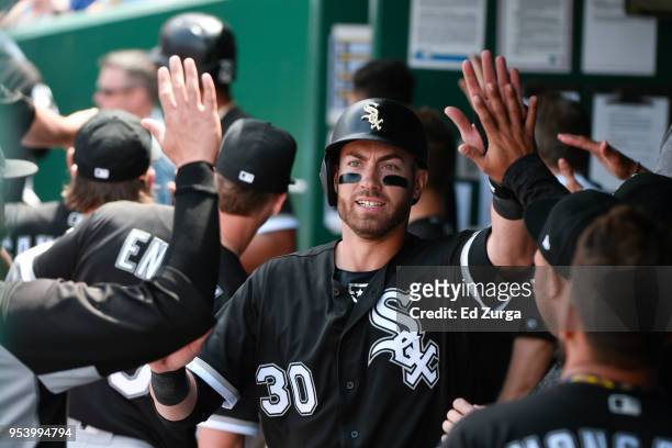 Nicky Delmonico of the Chicago White Sox celebrates with teammates after scoring against the Kansas City Royals at Kauffman Stadium on April 29, 2018...