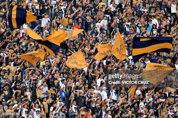 Pumas' fans cheer for their team during the match against America during their quarter final, first leg, Mexican Clausura tournament football match...