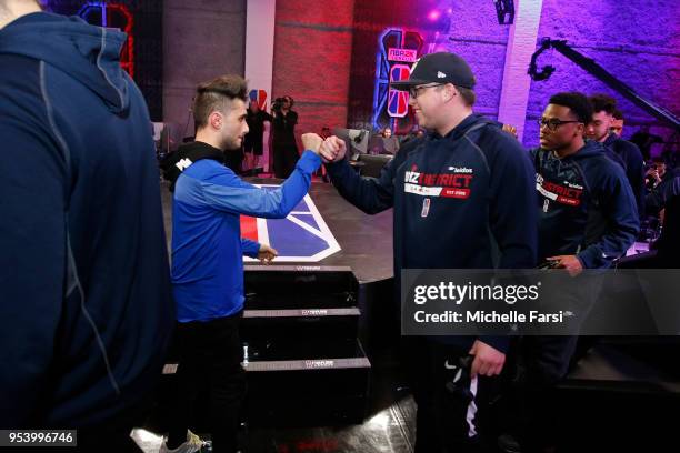 Iamadamthe1st of Knicks Gaming shakes hands with Boo Painter of Wizards District Gaming after the match up during the NBA 2K League Tip Off...