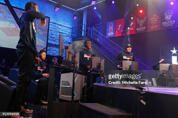 ReeseDaGod23 and the Wizards District Gaming celebrate a three point basket against Knicks Gaming during the NBA 2K League Tip Off Tournament on May...