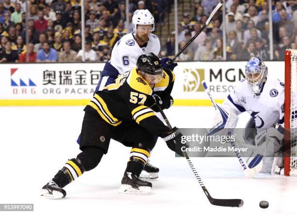 Tommy Wingels of the Boston Bruins skates against Anton Stralman of the Tampa Bay Lightning during the third period of Game Three of the Eastern...
