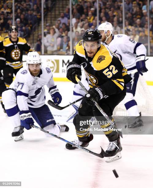 Victor Hedman of the Tampa Bay Lightning defends Sean Kuraly of the Boston Bruins during the third period of Game Three of the Eastern Conference...