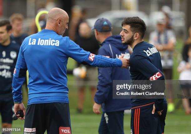 Victory coach Kevin Muscat speaks to Christian Theoharous of the Victory during a Melbourne Victory A-League training session at Gosch's Paddock on...