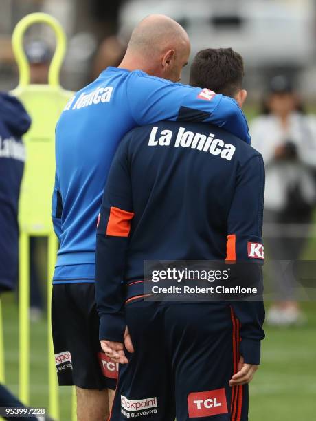 Victory coach Kevin Muscat speaks to Christian Theoharous of the Victory during a Melbourne Victory A-League training session at Gosch's Paddock on...