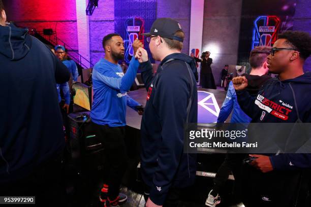 YEYNotGaming of Knicks Gaming shakes hands with Boo Painter of Wizards District Gaming after the match up during the NBA 2K League Tip Off Tournament...