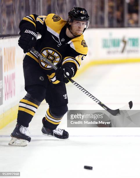 Torey Krug of the Boston Bruins skates against the Tampa Bay Lightning during the third period of Game Three of the Eastern Conference Second Round...