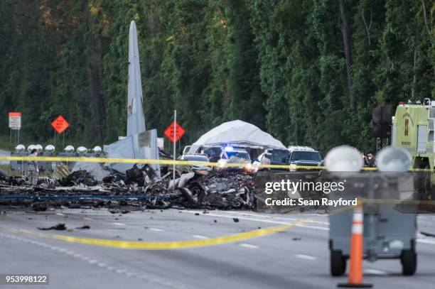 Wreckage is strewn across Route 21 where an Air National Guard C-130 cargo plane crashed May 2, 2018 in Port Wentworth, Georgia. The 50-year-old...