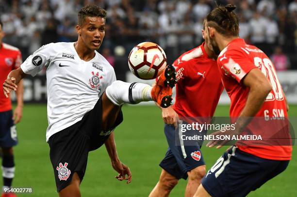 Pedrinho of Brazil's Corinthians vies for the ball with Gaston Silva of Argentina's Independiente during their 2018 Copa Libertadores football match...