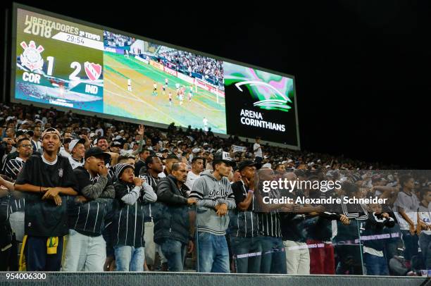 Fans of Corinthians of Brazil cheer during the match against Independiente for the Copa CONMEBOL Libertadores 2018 at Arena Corinthians Stadium on...