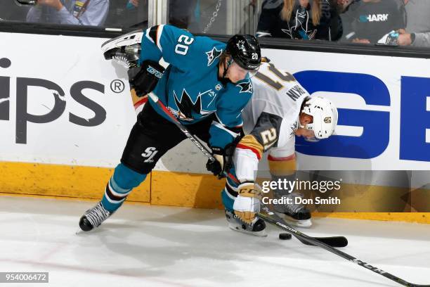 Marcus Sorensen of the San Jose Sharks and Cody Eakin of the Vegas Golden Knights battle along the boards in Game Four of the Western Conference...