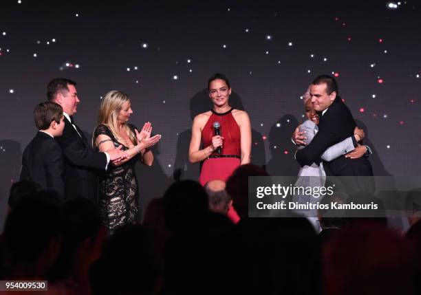 Founder Katharina Harf, Patient Marcus Cato and his family greet donor Matene Cates on stage during The DKMS Love Gala 2018 at Cipriani Wall Street...