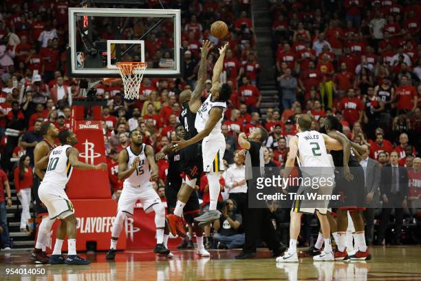 Tucker of the Houston Rockets and Donovan Mitchell of the Utah Jazz goes up or a jump ball in the second half during Game Two of the Western...