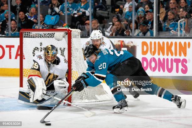 Marcus Sorensen reaches out for the puck as Marc-Andre Fleury and Jon Merrill of the Vegas Golden Knights defend in Game Four of the Western...