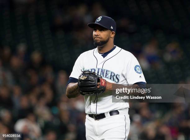 Juan Nicasio of the Seattle Mariners reacts after allowing a two run home run to Jed Lowrie of the Oakland Athletics in the eighth inning at Safeco...