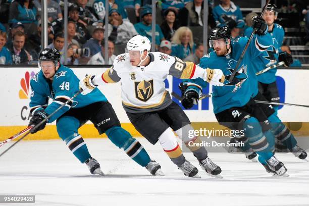 Alex Tuch of the Vegas Golden Knights chases after the puck with Tomas Hertl and Mikkel Boedker of the San Jose Sharks in Game Four of the Western...