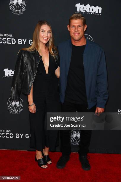 Mick Fanning and wife arrive at Teton Gravity Research's "Andy Iron's Kissed By God" World Premier at Regency Village Theatre on May 2, 2018 in...