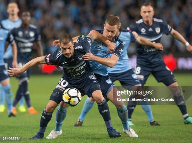 James Troisi of Melbourne is challenged by Sydney's Brandon O'Neill during the A-League Semi Final match between Sydney FC and Melbourne Victory at...