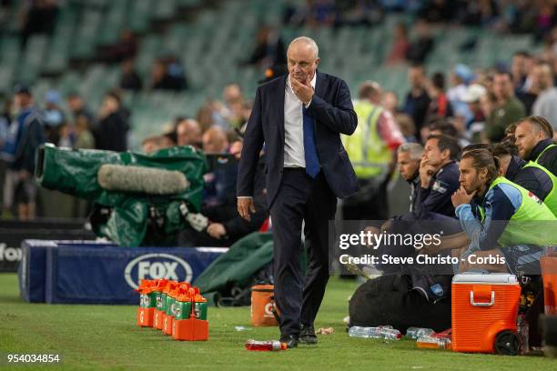 Graham Arnold of Sydney walks the coaches bench during the A-League Semi Final match between Sydney FC and Melbourne Victory at Allianz Stadium on...