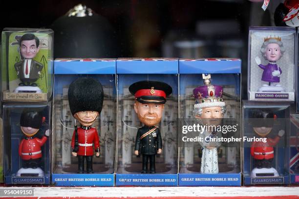 Souvenirs featuring Britain's Prince Harry and his fiance, US actress Meghan Markle are displayed in a gift shop on May 2, 2018 in Windsor, England....