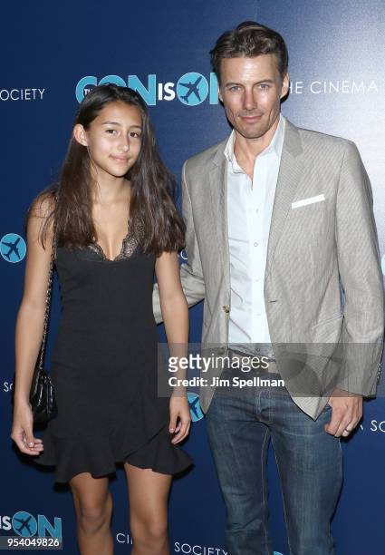 Model Alex Lundqvist and daughter attend the screening of "The Con Is On" hosted by The Cinema Society at The Roxy Cinema on May 2, 2018 in New York...