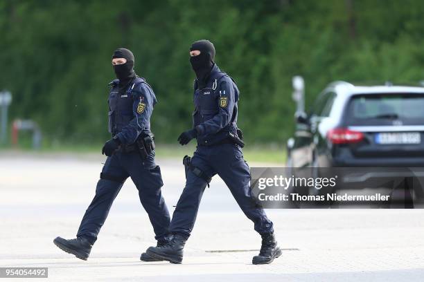 Police is seen at the main refugee center during an intervention there by riot police on May 3, 2018 in Ellwangen, Germany. Police raided the...