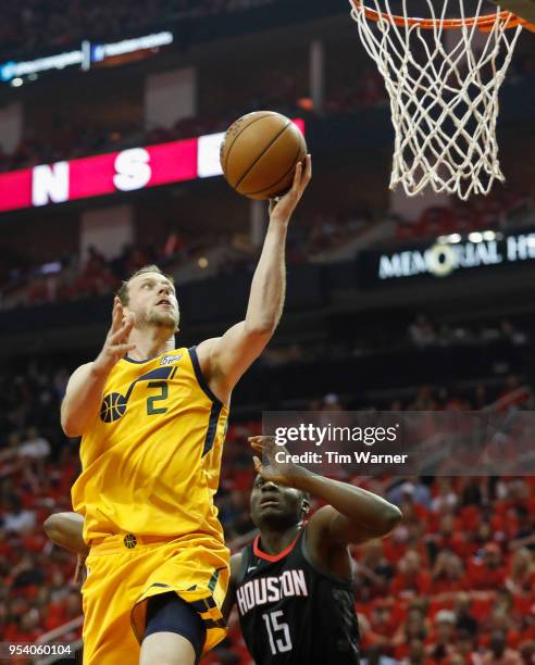 Joe Ingles of the Utah Jazz goes up for a lay up defended by Clint Capela of the Houston Rockets in the first half during Game One of the Western...