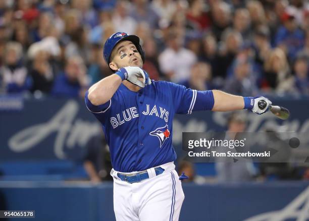 Steve Pearce of the Toronto Blue Jays watches a foul ball sail out of play as he bats in the fourth inning during MLB game action against the Texas...