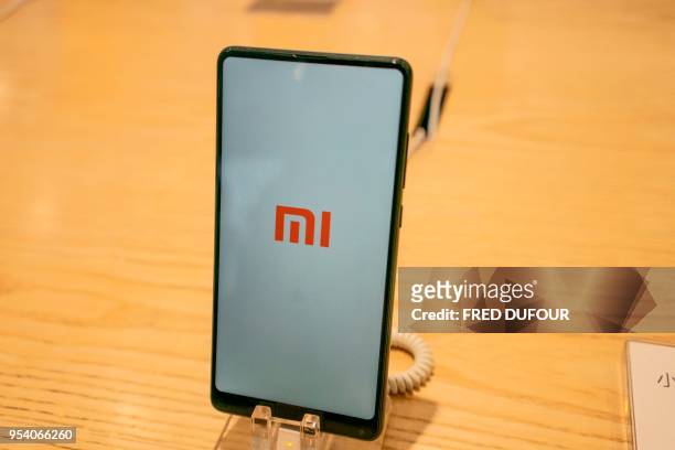 Picture shows a Xiaomi smartphone in a shop in Beijing on May 3, 2018. - Chinese smartphone maker Xiaomi has kicked off what is expected to be the...